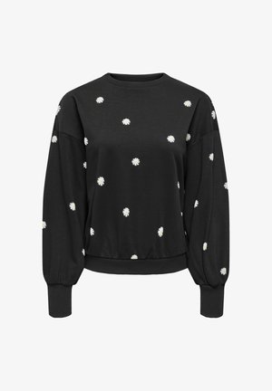 Must mustaärkidega must pusa, millel on dispergeeritud valged karikakrad ning soonilised varrukate ja ääre servad, esitatud valgel taustal.