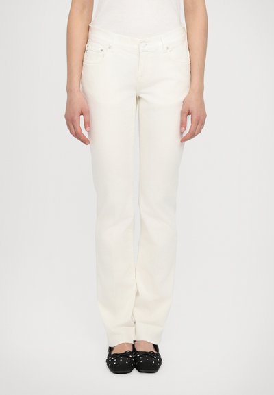 White jeans with a straight leg design, made from denim. Features front pockets and a belt loop waist with silver hardware accents.