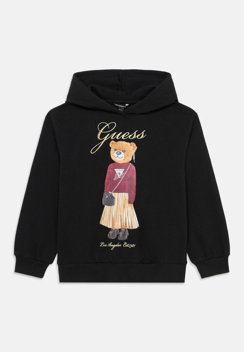 Sudadera negra con un gráfico de un oso vestido con una camiseta roja y una falda de plisado. Los detalles incluyen el logo de "Guess" en dorado.