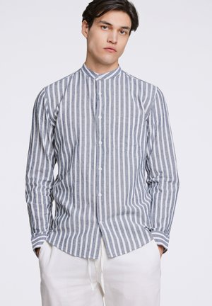 Striped long-sleeve shirt in light blue and white, featuring a stand collar, button front, and a chest pocket, made from lightweight fabric.