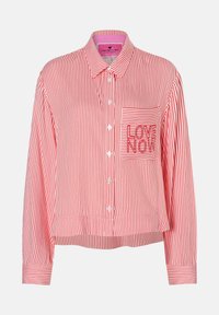 Red and white striped button-up shirt featuring a left chest pocket with "LOVE NOW" stitched in matching thread. Collared and cropped design.