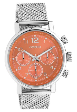 Silver mesh strap watch with an orange face, three sub-dials, large hour markers, and a tachymeter scale around the edge.