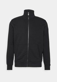 Svart zip-up sweatshirt i mjukt tyg, med hög krage, två framfickor samt ribbade ärmslut och nederkant. Klassisk design.