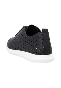 Black sneaker with hexagonal perforations, textured upper, and a white rubber sole. Features a flat heel and lace-up design for secure fit.