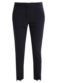 Pantalon sur mesure bleu marine foncé en tissu lisse avec poches avant et fentes à la cheville. Caractérisé par une silhouette épurée et structurée ainsi qu'un design élégant.