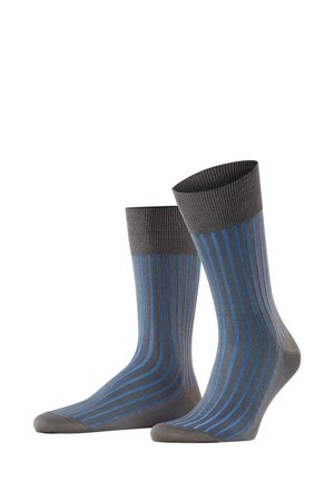 Gray socks with blue vertical stripes, featuring a ribbed cuff and smooth texture, positioned upright against a plain white background.