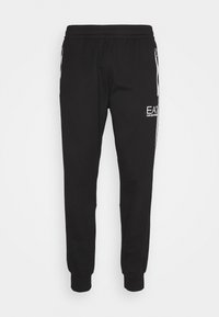 Svarta joggers med elastisk midja och mudd, med sidofickor med dragkedja och vitt logotyp på vänster lår. Tillverkade av ett mjukt tyg.