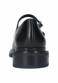 Chaussure en cuir noir avec une finition lisse, dotée d'un bout arrondi et d'une sangle ajustable. Talon épais et solide avec un aspect poli.