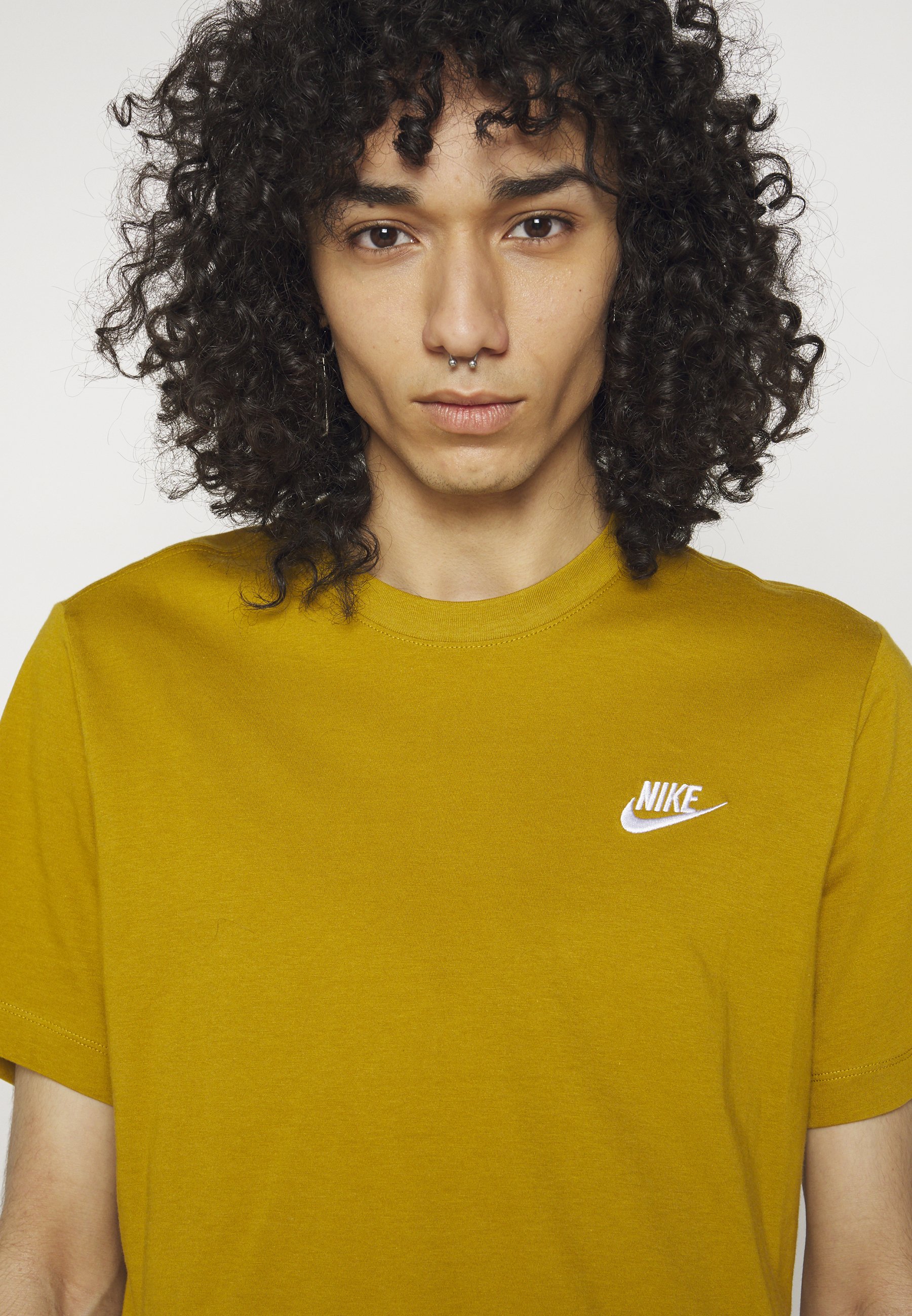 mustard yellow nike shirt