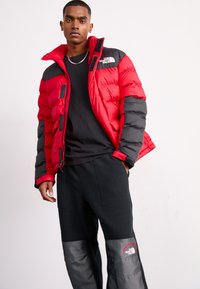 The North Face M RETRO DENALI PANT - Tracksuit bottoms - black/moonstone grey