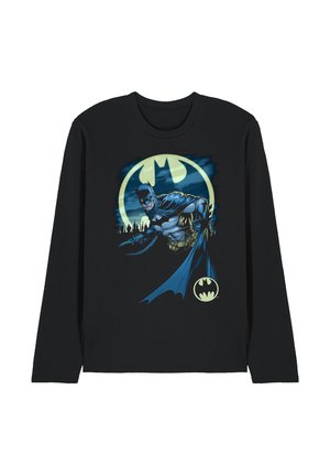 Black long-sleeve shirt with a graphic of Batman in front of a glowing Bat-Signal and city skyline at night.