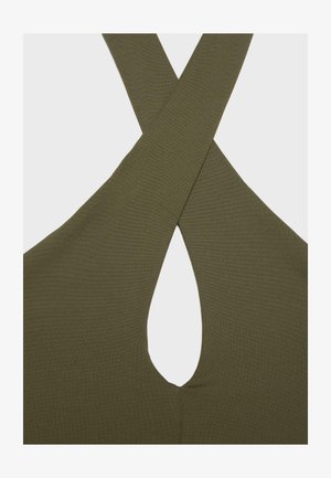 Olivgrüner Stoff mit einem überkreuzten Design, das in der Mitte eine schlüssellochförmige Öffnung bildet.