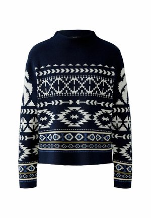 Marineblauer Strickpullover mit weißen geometrischen Mustern, hohem Kragen und cropped Design. Strukturierter Stoff, lange Ärmel mit gemusterten Bündchen.