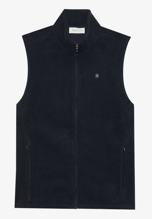 Tumši zilas krāsas flīsa veste ar augstu apkakli, priekšējo rāvējslēdzēju un sānu kabatām. Uz krūšu ir neliela logotipa izvietojums. Mīksta tekstūra.