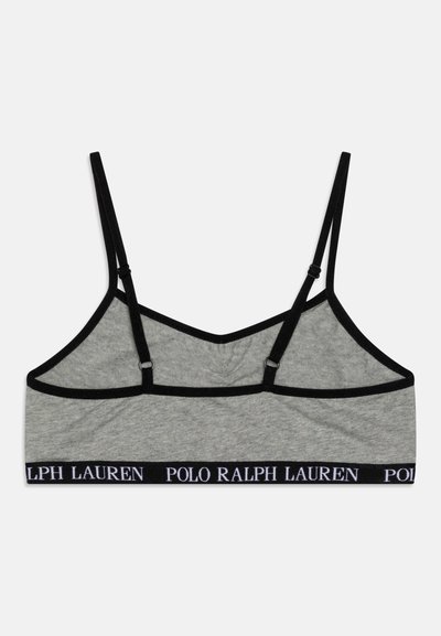 Siva bombažna bralette s črnimi nastavljivimi naramnicami in širokim elastičnim pasom, ki nosi napis "POLO RALPH LAUREN". Gladka tekstura, športen dizajn.