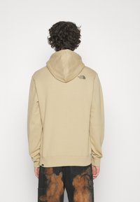 The North Face Jersey con capucha - sand