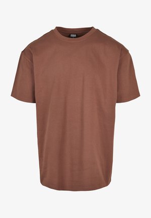 Prosty, brązowy t-shirt z krótkim rękawem i okrągłym dekoltem, luźny krój, z metką Urban Classics wewnątrz tylnego kołnierza.