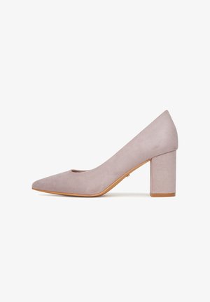 Zapato de mujer de ante color malva claro con puntera puntiaguda y tacón bloque grueso de altura media, mostrado de perfil sobre un fondo blanco.