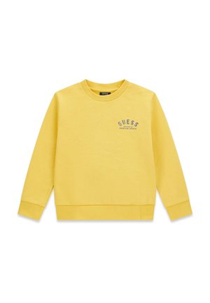 Gele longsleeve trui met geribde manchetten en zoom, met kleine "GUESS Division 81 American Sports" tekst op de linkerborst.