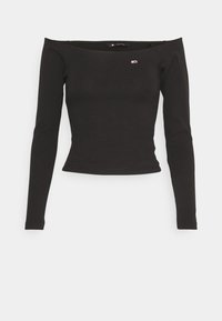 Schwarzes, geripptes Langarmshirt mit Off-Shoulder-Design und einem kleinen Logoakzent auf der Brust. Glatte Textur, figurbetonte Passform.