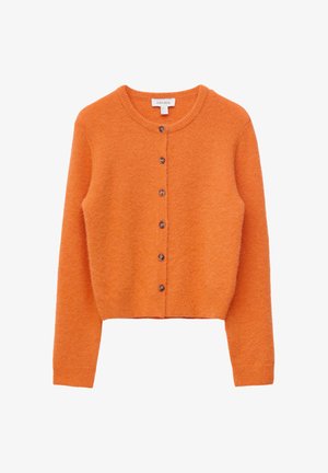 Oranssin värinen pitkähihainen villatakki, jossa pyöreä pääntie ja kuusi ruskeaa nappia edessä.