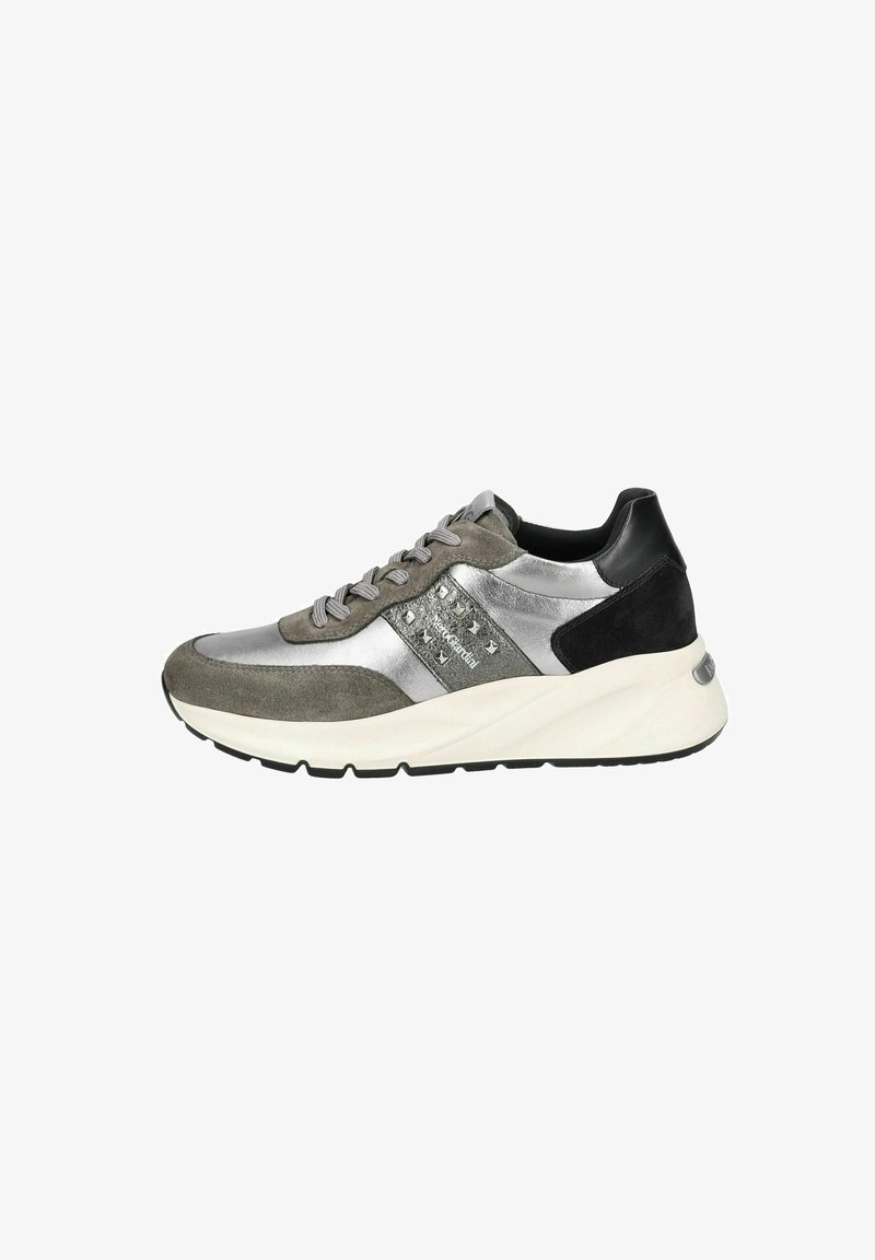Silver and gray sneaker made of leather and suede, featuring a thick white sole, round toe, and gray laces. Notable studded accent.