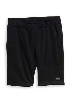 Pantaloncini con vita elastica neri, tasche laterali e una piccola toppa rettangolare con logo vicino all'orlo inferiore sulla gamba sinistra.