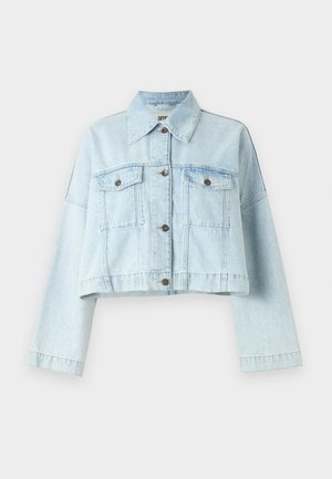 Light blue cropped denim jacket with long sleeves, two chest pockets, and gold-tone buttons. Made from soft, textured cotton fabric.