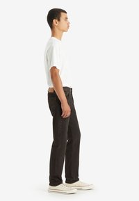 Levi's® 502™ brązowy