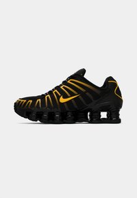 SHOX TL - Sportbačiai - black/university gold