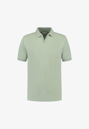 Lys grønn polo-skjorte laget av myk bomull, med V-hals, korte ermer og ribbestrikket krage med matching mansjetter. Diskret logo-detalj.