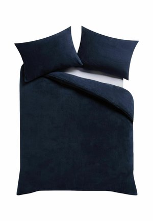 Dark blue bedding set with two matching pillows and a partially folded duvet on a white background.