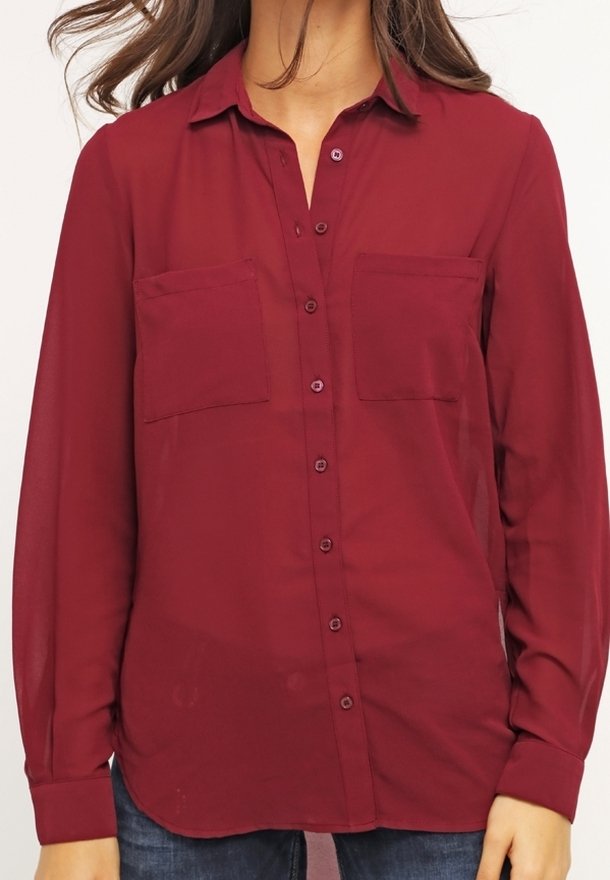 Burgundy button-up shirt with a collar, two chest pockets, long sleeves, and a lightweight, semi-transparent fabric.