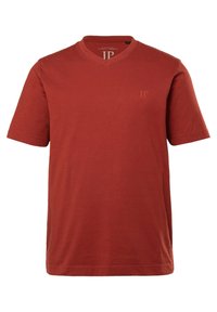 V-hals, kortærmet t-shirt i rust rød. Fremstillet af blødt bomuld, med et diskret JP-logo på brystet. Glat tekstur, klassisk pasform.