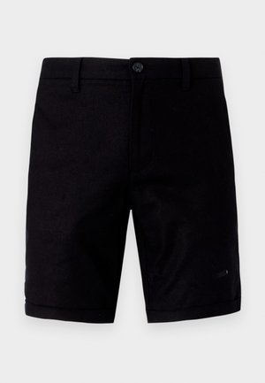 Svarte shorts med en glatt tekstur, med knappelukking, tradisjonelle lommer og oppbrettede ermer. Laget av lett stoff.