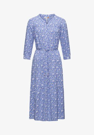 Kukkakuosiset, polvipituiset mekko vaaleansinisenä, V-pääntiellä, kolmen neljänneksen hihoilla ja vyötärö kyllätettynä. Pehmeää ja kevyttä kangasta.