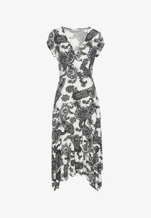 Schwarz-weiß gemustertes Kleid mit V-Ausschnitt, kurzen Ärmeln und einem ausgestellt geschnittenen Saum mit asymmetrischen Details. Hergestellt aus leichtem Stoff.