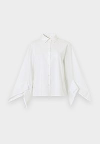 Λευκό πουκάμισο με κλασικό γιακά και κουμπιά στο μπροστινό μέρος. Διαθέτει μακριά, φαρδιά μανίκια που στενεύουν στους καρπούς. Κατασκευασμένο από απαλό ύφασμα.