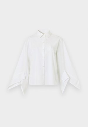 White shirt with a classic collar and button front. Features long, wide sleeves that taper at the wrists. Made from smooth fabric.
