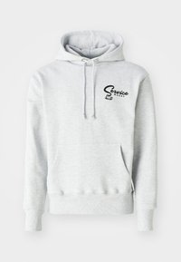 Gray hoodie made of soft fabric, featuring a front pocket, drawstring hood, and a black "Service Works" logo on the left chest area.