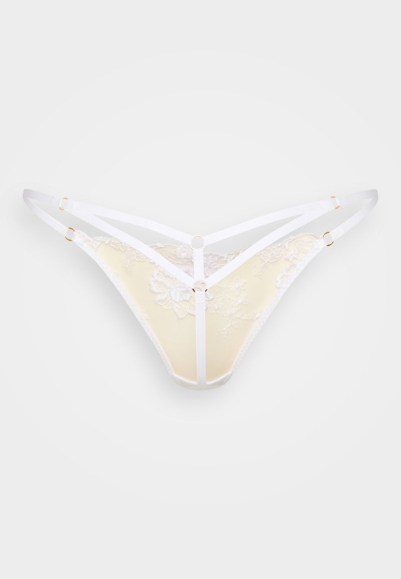 Spetsstring i mjukt gult med vita elastiska band. Blommönster på tyget, med gulddetaljer och en V-formad design.