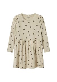 Robe beige côtelée à manches longues, ornée de petits motifs floraux sombres et d'un design de jupe froncée. Détail de décolleté festonné.