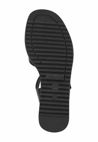 Svart gummisula med horisontella spår för grepp, med ett slätt tånät och varumärkesdetalj "Tamaris" med storlek "37."