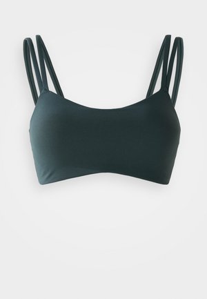 Tumši zaļš bikini augšdaļa ar gludu tekstūru, vienkārša dizaina, taisnstūra formas un šaurām regulējamām siksnām.