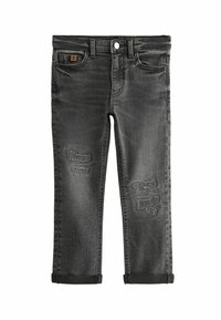 Jeans in denim nero con toppe strappate, design classico a cinque tasche e orli arrotolati alle caviglie. Chiusura standard con zip e bottone.