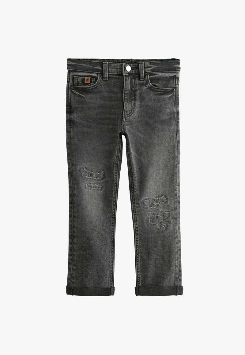 Vaqueros de mezclilla negra con parches desgastados, un diseño clásico de cinco bolsillos y puños enrollados en los tobillos. Cierre estándar con cremallera y botón.