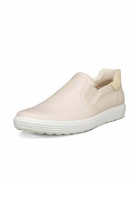 Scarpa slip-on in pelle beige chiaro con pannelli elastici laterali, punta rotonda e suola in gomma bianca con dettagli testurizzati sui lati.