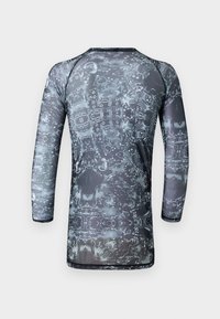 Long-sleeve, form-fitting shirt made of lightweight, stretchy fabric featuring a gray and black abstract pattern with a solid black neckline.