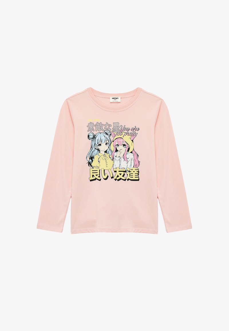 Lange mouwen, lichtroze katoenen t-shirt met cartoonfiguren met blauw en roze haar. Tekstafbeelding in zwart en geel.