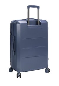 Hartschalenkoffer in Dunkelblau, ausgestattet mit einem ausziehbaren Griff, vier Rollen, gerilltem Muster an den Seiten und einem seitlichen Traggriff.